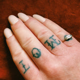 Gold and platinum diamond trilogy ring